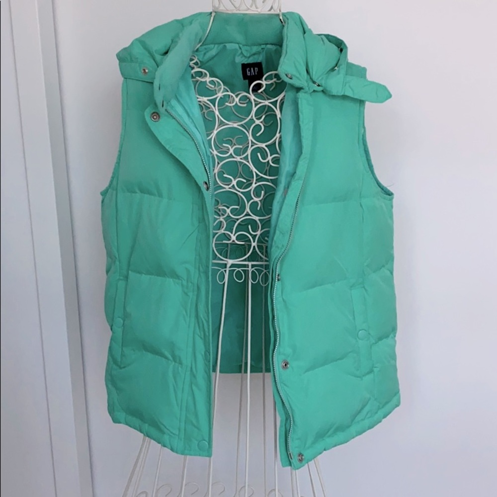 Teal puffy vest with detachable hood and fur trim